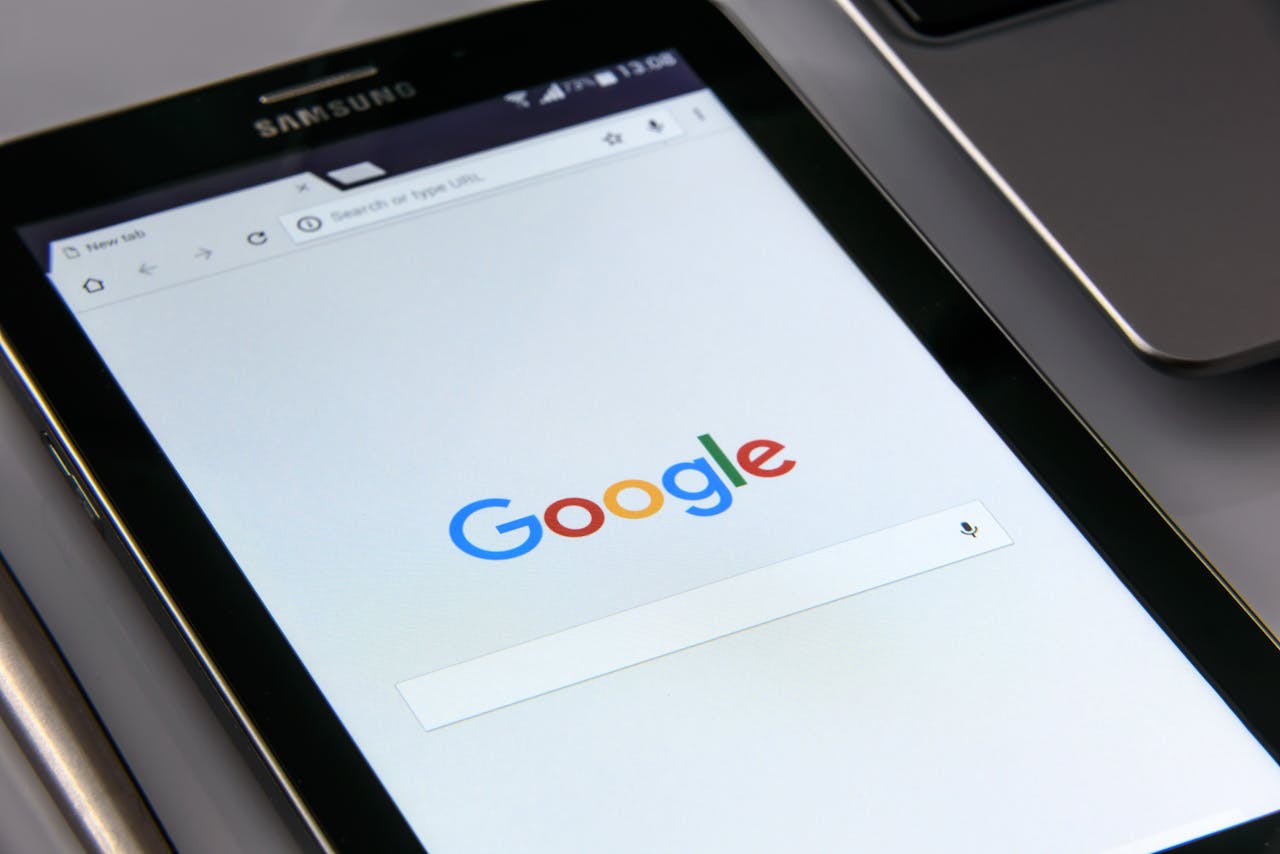 Close-up of a tablet displaying Google